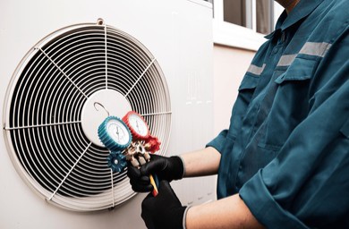 Razorback technician servicing an outdoor AC unit
